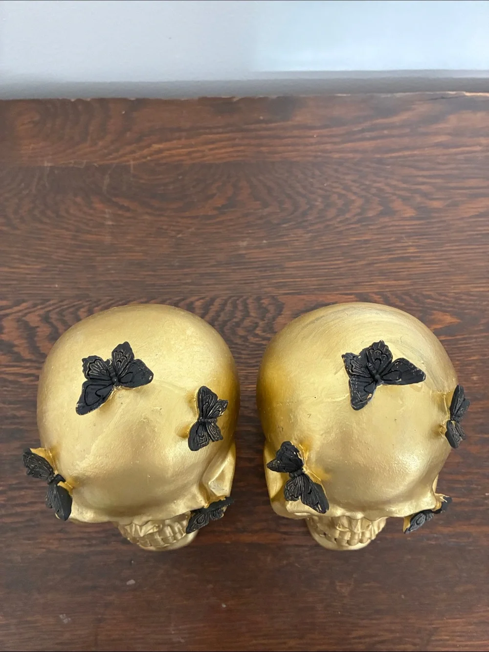 NWT- Set of 2- STUNNING- Gold Skull Statues with Black Butterflies Accents